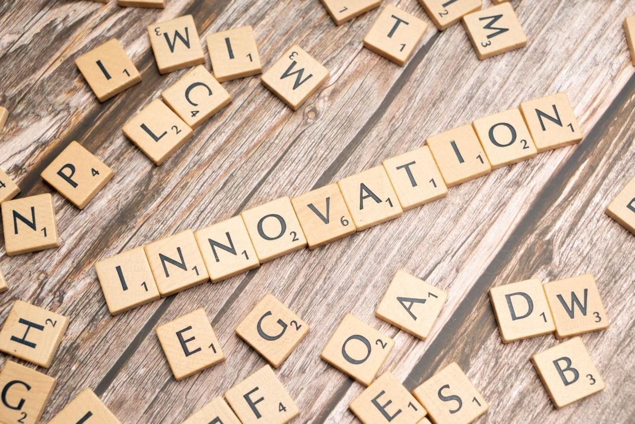Wooden letter tiles spelling the word INNOVATION